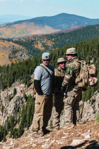 Director Peter Berg goes over a scene on the side of a mountain