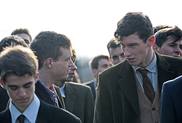 Bill (Callum Turner)  introduces himself to Percy (Caleb Landry Jones) on their way to boot camp