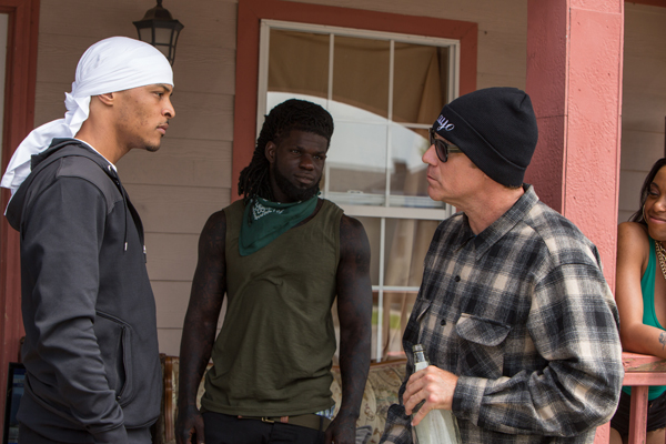 Russell (Tip TI Harris) tells James (Ferrell) how to act around prisoners