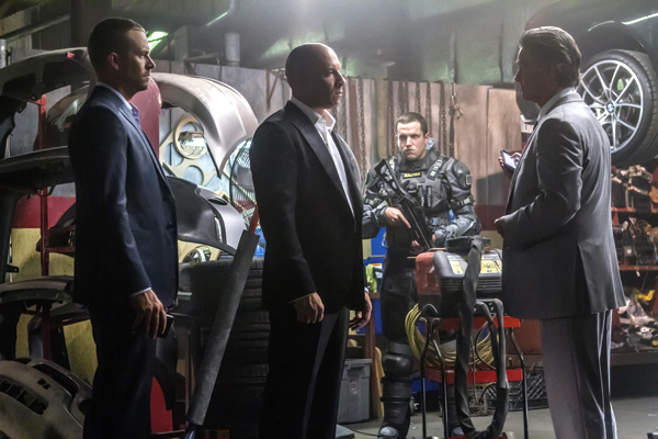Brian (Paul Walker) and Dom (Vin Diesel) meet with a high-level government operative (Kurt Russell)