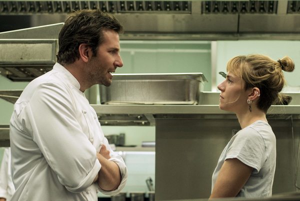 Adam (Bradley Cooper) fights with his sous chef Helene Sweeney (Sienna Miller) in BURNT