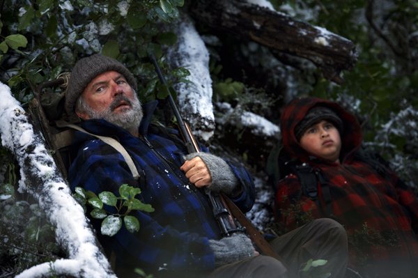 Being hunted by the police, Hec and Ricky take cover in the woods