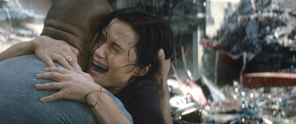 Emma embraces Ray in the midst of distruction