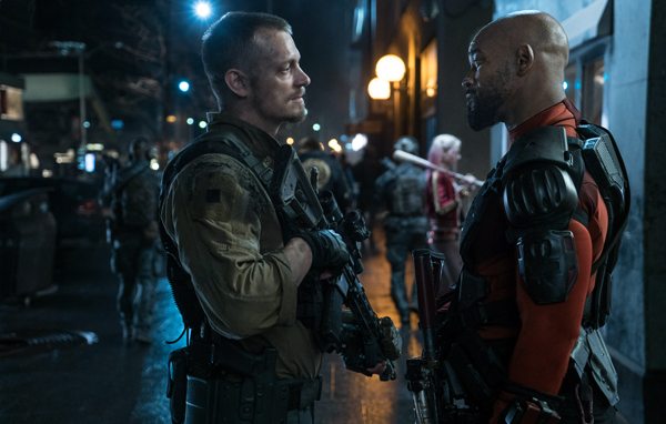 JOEL KINNAMAN as Rick Flag and WILL SMITH as Deadshot