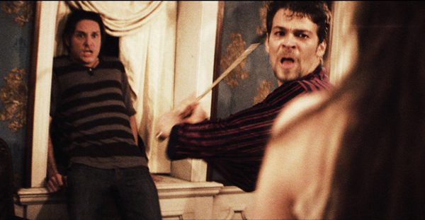 Joe Davenport (Juan Riedinger) fights off Alice's (Sarah Nicklin) apparition