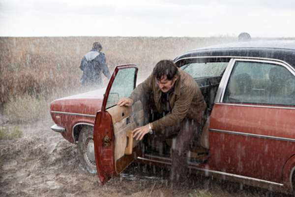 Juan (Javier Gutierrez) gets out of his car to check out a suspect