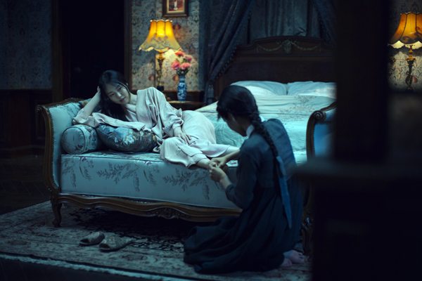 Lady Hideko (Kim Min-hee) being attended to by Sook-Hee (Kim Tae-ri) in THE HANDMAIDEN