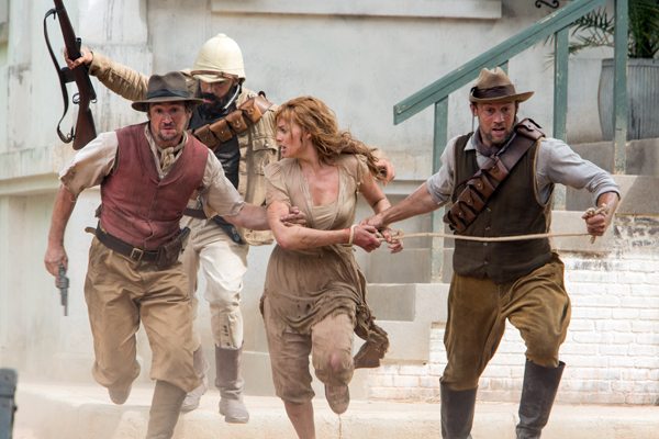 MARGOT ROBBIE as Jane being taken as hostage