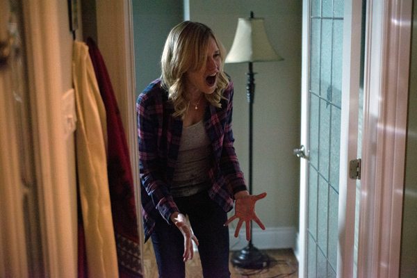 Meg (Laura Allen) sees a ghastly sight in CLOWN