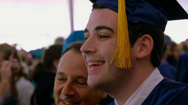 Owen at his graduation with his dad Ron