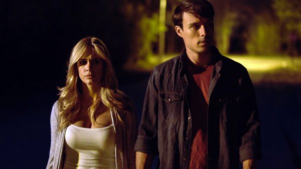 Sarah (Lauren Elise) and Brad (Brian Nagel) walk around the sicko town of Clinton CLOWNTOWN