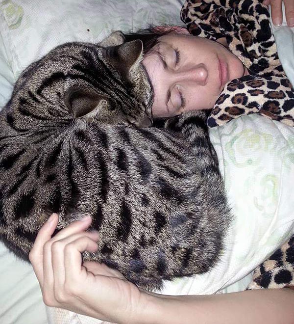 Monkey, sound asleep on his person’s head.