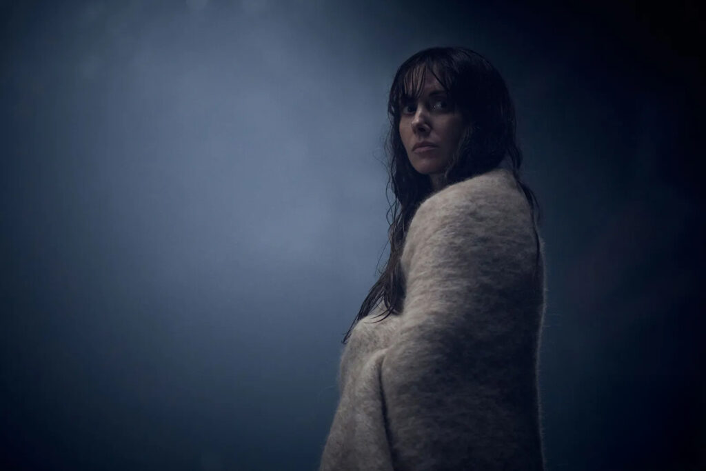 a woman wrapped in a blanket