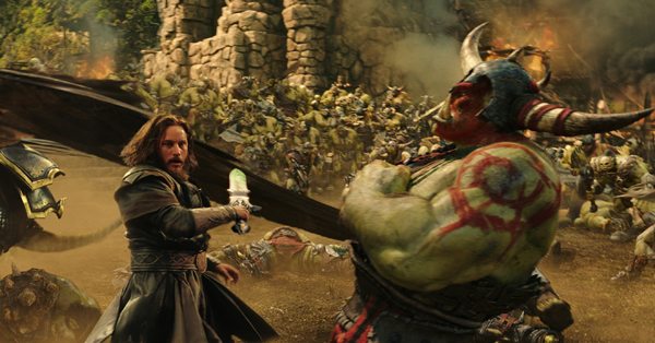 Commander Anduin Lothar (TRAVIS FIMMEL) defends himself against an orc from The Horde in "Warcraft."  