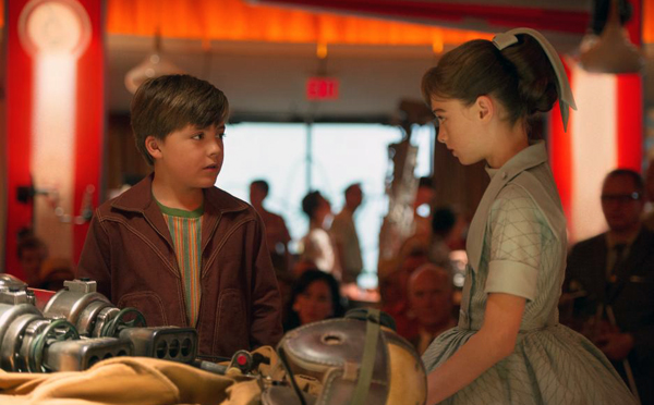 Young Frank (Thomas Robinson) meets Athena (Raffey Cassidy) in TOMORROWLAND